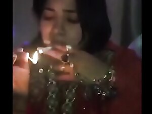 Indian inebriated girl engages in risqué talk and smokes while filming, leading to a steamy encounter.